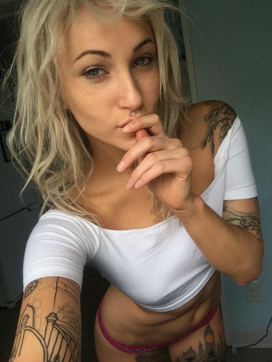 Sexy tattoed blonde in pink panties